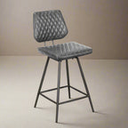 Gray quilted bar stool on a white background